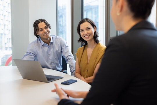 Young employee listening in a business meeting
