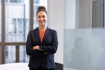 Portrait of a young employee in a corporate office