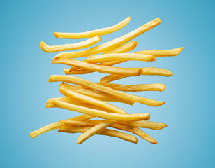 Crispy Golden French Fries Floating on Bright Blue Background