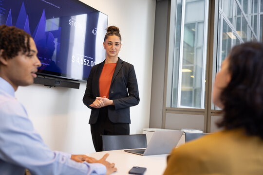 New employee presenting to coworkers in a corporate office