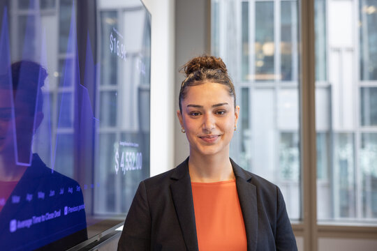 Portrait of a young businesswoman with her presentation