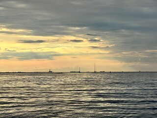silhouette of a yacht at sunset