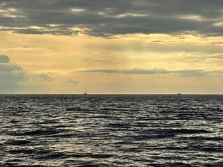 silhouette of a yacht at sunset