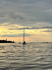 silhouette of a yacht at sunset