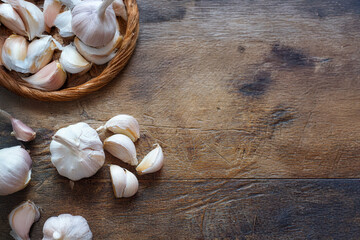 Fresh garlic on white wooden table, closeup