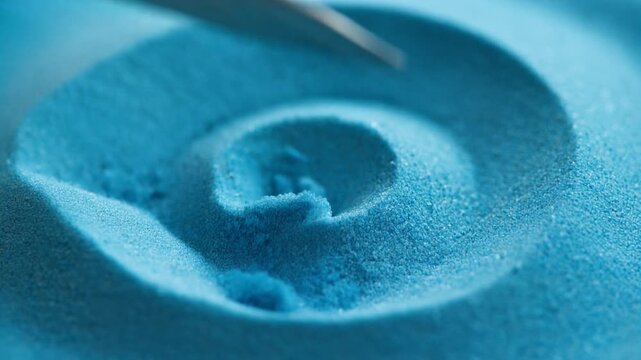Ultra Slow Motion Macro: Clean Slice Through Vibrant Blue Kinetic Sand Texture