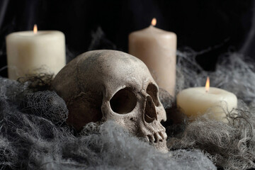 Halloween background with scull and candles.