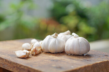 Fresh garlic on white wooden table, closeup