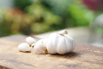 Fresh garlic on white wooden table, closeup
