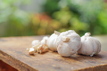 Fresh garlic on white wooden table, closeup