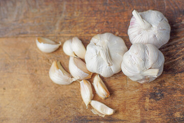 Fresh garlic on white wooden table, closeup