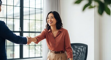 Professional handshake between colleagues demonstrating corporate collaboration indoors meeting