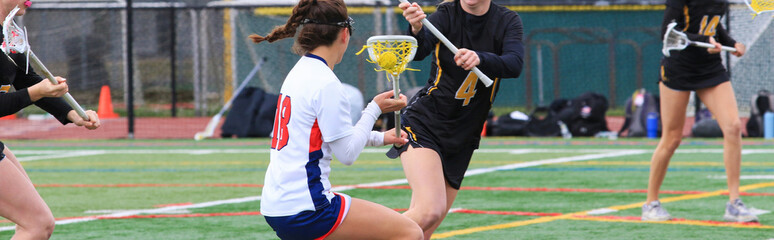 Girls Lacrosse Game With Action on the Field in Spring Season