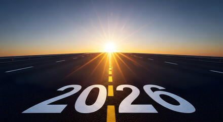 Asphalt road stretches out toward a vibrant sunrise, the year 2026 painted boldly on the pavement symbolizing ambition, forward-thinking planning, and the promise of new beginnings with clear