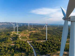 Wind turbine landscape in Terra Alta Catalonia Spain highlighting renewable energy and sustainability as the terrain opens toward the distant horizon under gentle natural light