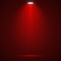 Red spotlight shining down creating a dramatic effect ideal for product presentations or stage backgrounds