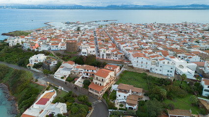 Obraz premium Aerial view of Calasetta with historic tower and coastline.