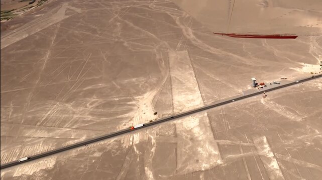 Mysterious Nazca Lines tree and hummingbird figures etched into the arid desert, a UNESCO World Heritage site near a highway in Peru