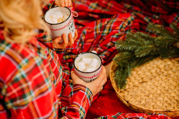 Cozy Christmas Setting with Hot Cocoa and Marshmallows on Festive Bed