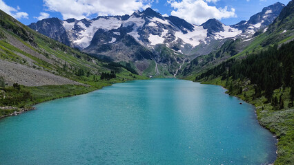 Drone flight over the turquoise-colored Transverse Lake in Altai