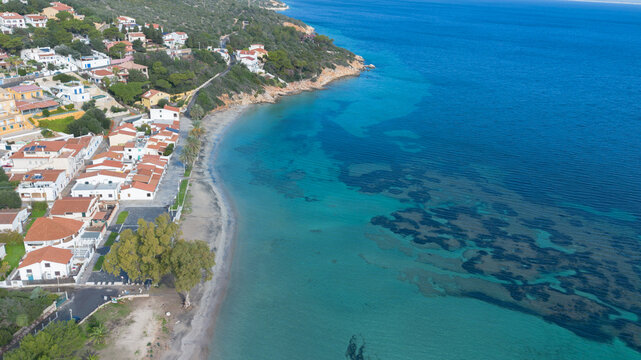 Coastal village and turquoise bay of Maladroxia in Sant Antioco.