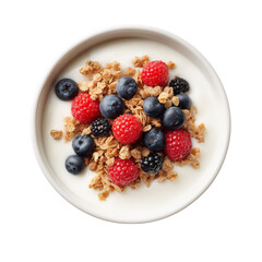 A top-down view of a white bowl filled with creamy yogurt topped with granola, fresh raspberries, blueberries, and blackberries. 
