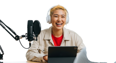 Young woman with headphones enthusiastically laughing while recording a podcast, isolated on transparent background