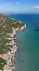 Crystal cove and cliff houses near Su Portixeddu in Sant Antioco.