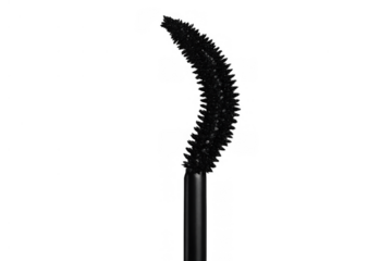 Mascara wand with black bristles separating and lengthening eyelashes, essential beauty tool on transparent background