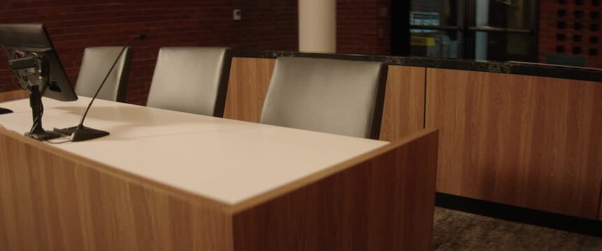 Part of a series of shots inside an empty United States public courtroom. Themes of justice, trial, crime and law. Filmed with anamorphic lenses in 2.39:1 scope ratio.