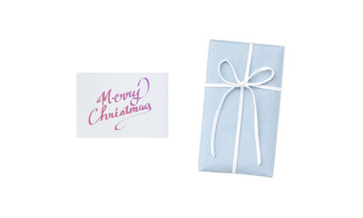Overhead view of a pale blue gift box with a white ribbon and a Christmas card featuring pale purple handwritten text	