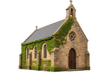 Isolated building an old stone chapel with a cross and steeple, overgrown with ivy