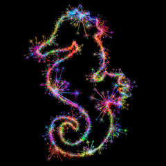 Kolorowe fajerwerki i zimne ognie układające się w kształt konika morskiego