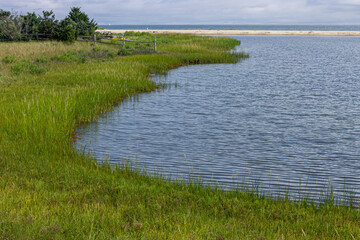 Martha's Vineyard, Massachusetts. Lighthouse Beach near Edgartown Harbor Lighthouse showing coastal sand and open shoreline by the surrounding waters