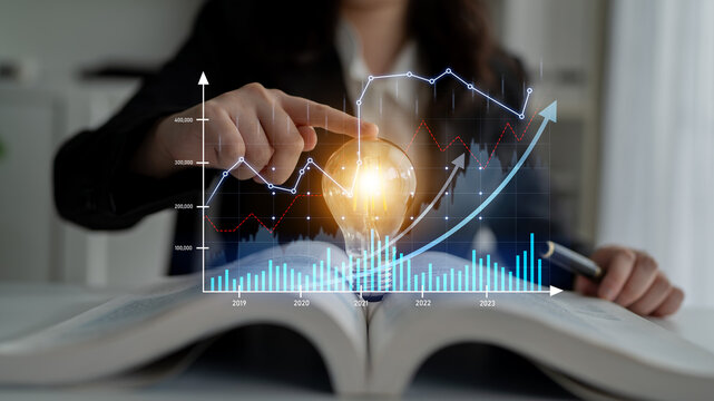 A business professional engaged in financial analysis showcases a light bulb concept representing innovation, with detailed graphs and charts depicting growth and strategies. Scalp