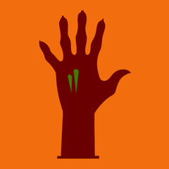 Dark hand with green splatters on orange background