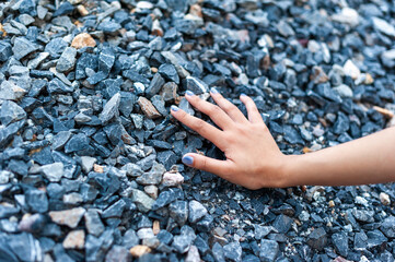 Exploring textured surfaces hand rocks outdoor setting close-up natural environment