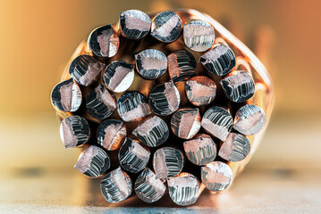 A bundle of copper rods in an industrial space, a close-up of non-ferrous metal structure