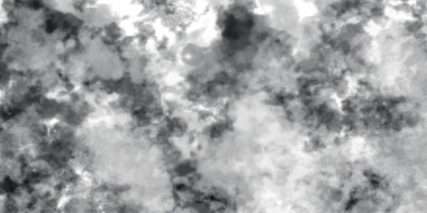 Soft, swirling grayscale clouds forming an abstract, misty backdrop. The blending tones of grey and white create a textured effect similar to smoke, fog, or ink washes, 