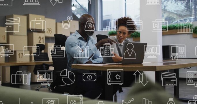 Pointing man in light blue shirt, woman in gray sweater, reviewing laptop data in modern office