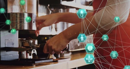 Pulling barista hands locking portafilter into espresso machine at cafe, teal overlay, red apron