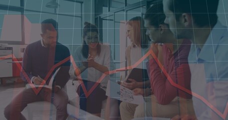 Discussing five staff in workwear in office lounge, tapping phone, pointing charts with red overlay