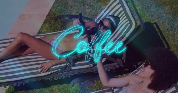 Lounging two women wearing bikinis shades headband on striped chairs poolside neon Coffee script