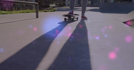 Balancing female on skateboard at skatepark, wearing red sneakers, long shadows, lens flare
