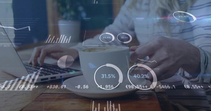 Sipping woman wearing striped top holding white cup and saucer at desk with laptop data overlays