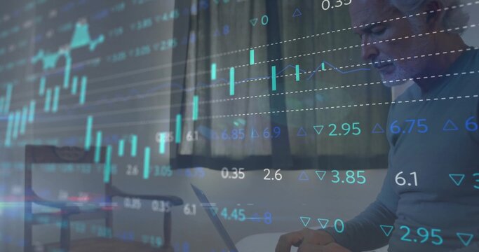 Tracking financial charts, mature man wearing light sweater using laptop in home office, copy space - Powered by Adobe