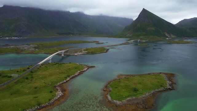Drone aerial 4k footage of fredvang bridges stretches over tranquil waters, linking several fjords. Lofoten Islands, Norway. Nordland transportation infrastructure