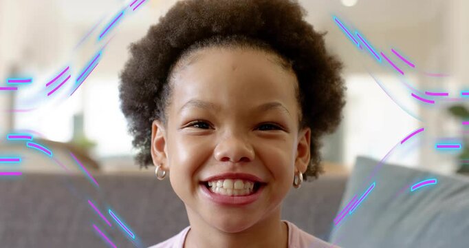 Girl sitting on couch reacting to animated streaks, smiling broadly then relaxing for marketing