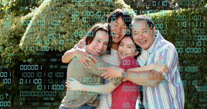 Family of four leaning in, hugging warmly in garden, teal binary tech overlay obscuring faces