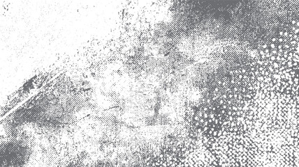Monochrome distressed halftone texture background with scattered dots and irregular shapes in shades of gray and white